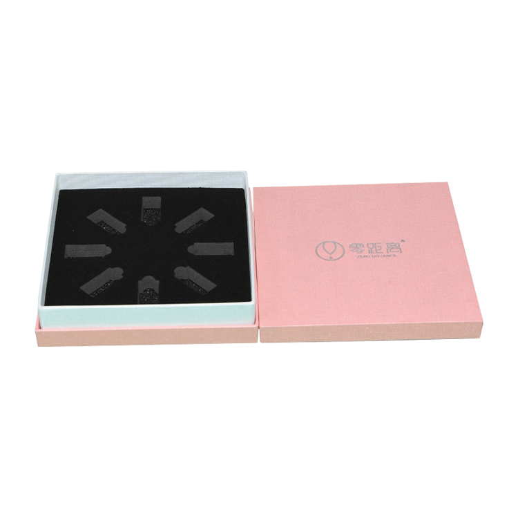 Caja de regalo rosa rectangular de cartón con base y tapa personalizada con textura con soporte de terciopelo para envases para el cuidado de la piel